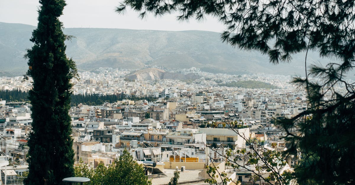 Can I travel to Spain using a Greek Schengen visa even if I don't want to stay in Greece at all? [duplicate] - White and Brown Concrete Buildings Near Green Trees
