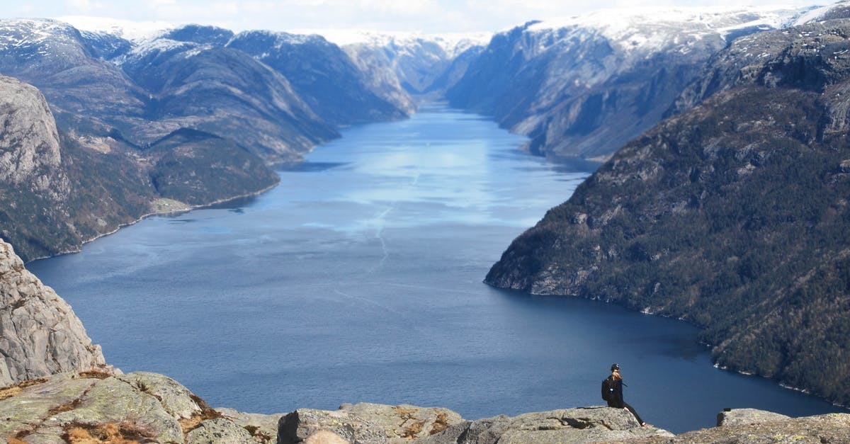 Can I travel to Svalbard and back from Norway on a Dutch Identity card? - Unrecognizable hiker contemplating dramatic fjord on rocky mountain peak Can I travel to Svalbard and back from Norway on a Dutch Identity card? - Unrecognizable hiker contemplating dramatic fjord on rocky mountain peak