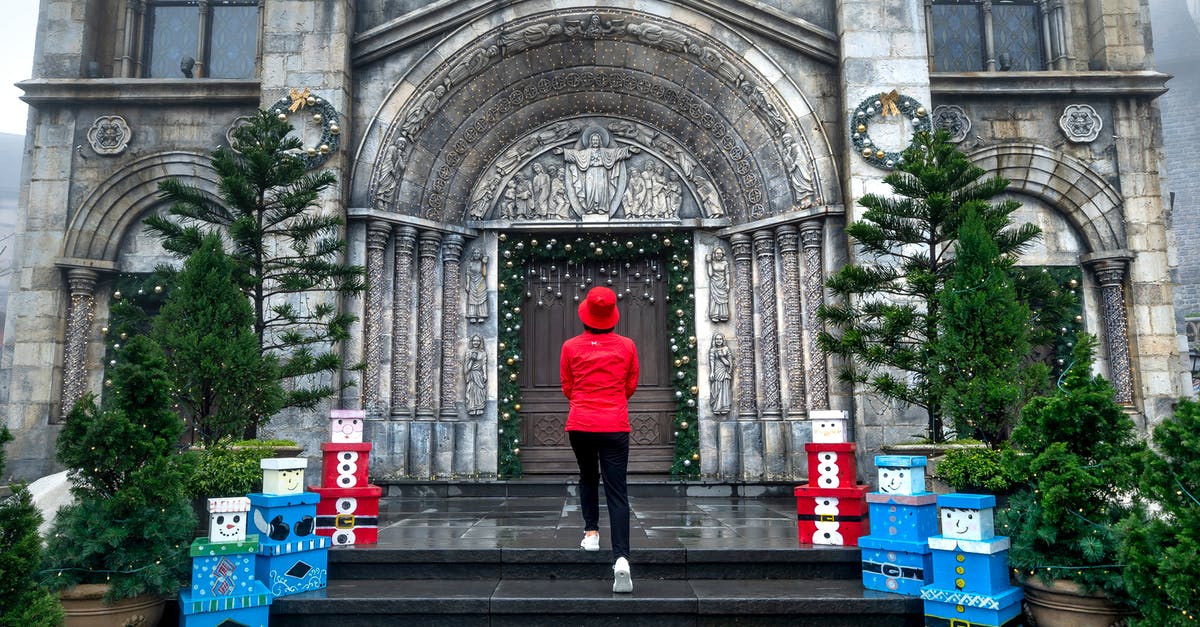 Can I travel to Vietnam for Christmas in 2020? - A Woman in Red Jacket Standing at the Doorway Can I travel to Vietnam for Christmas in 2020? - A Woman in Red Jacket Standing at the Doorway