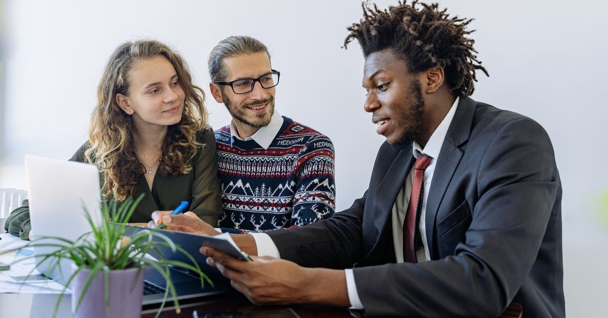 Can I use a mortgage loan paid by my employer as source of funds for my Uk visitor visa application [closed] - Man in Black Suit Jacket Sitting Beside Woman in Brown and Black Long Sleeve Shirt