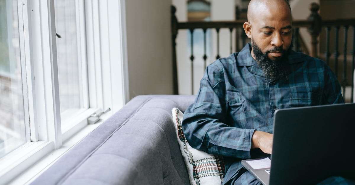 Can I use a Schengen type C Visa (Tourism) for Business? - Serious black man using laptop at home