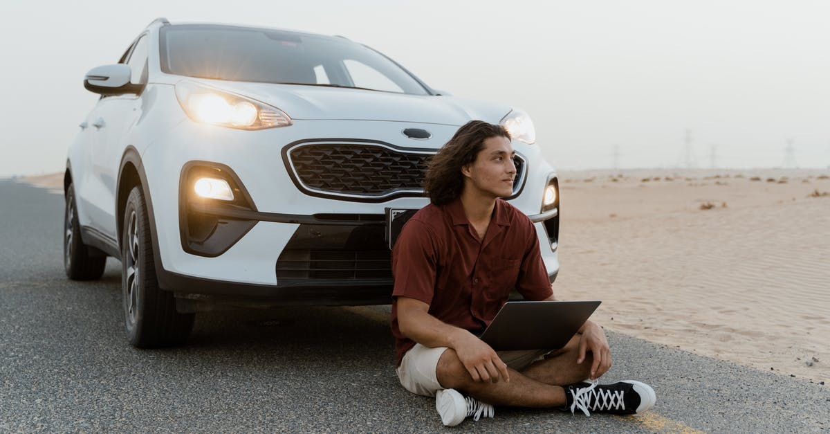Can I use a second passport for Dubai layovers? - Man Sitting on the Road In Front of a White Car in the Desert Can I use a second passport for Dubai layovers? - Man Sitting on the Road In Front of a White Car in the Desert