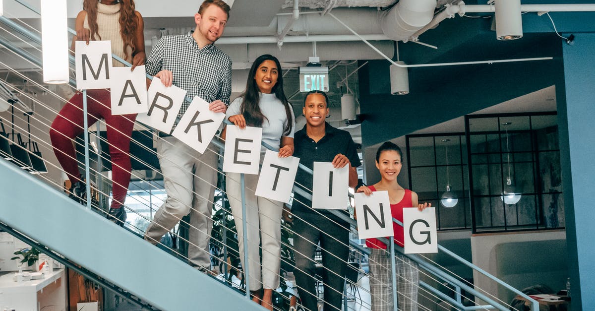 Can I use a US Business visa obtained while working from one company to travel for another? [duplicate] - Group of People Standing on a Building