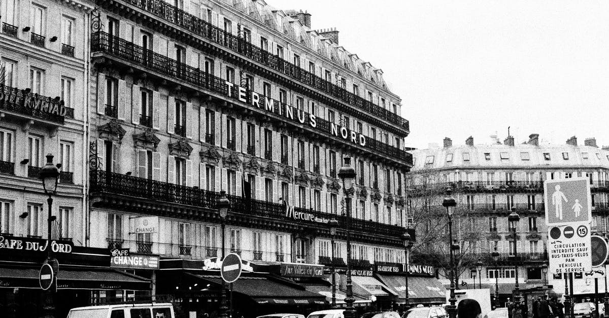 Can I use a visa issued by the Netherlands (Schengen) to travel to Paris as my first entry? [duplicate] - Grayscale Photo of Cars Parked Near Building