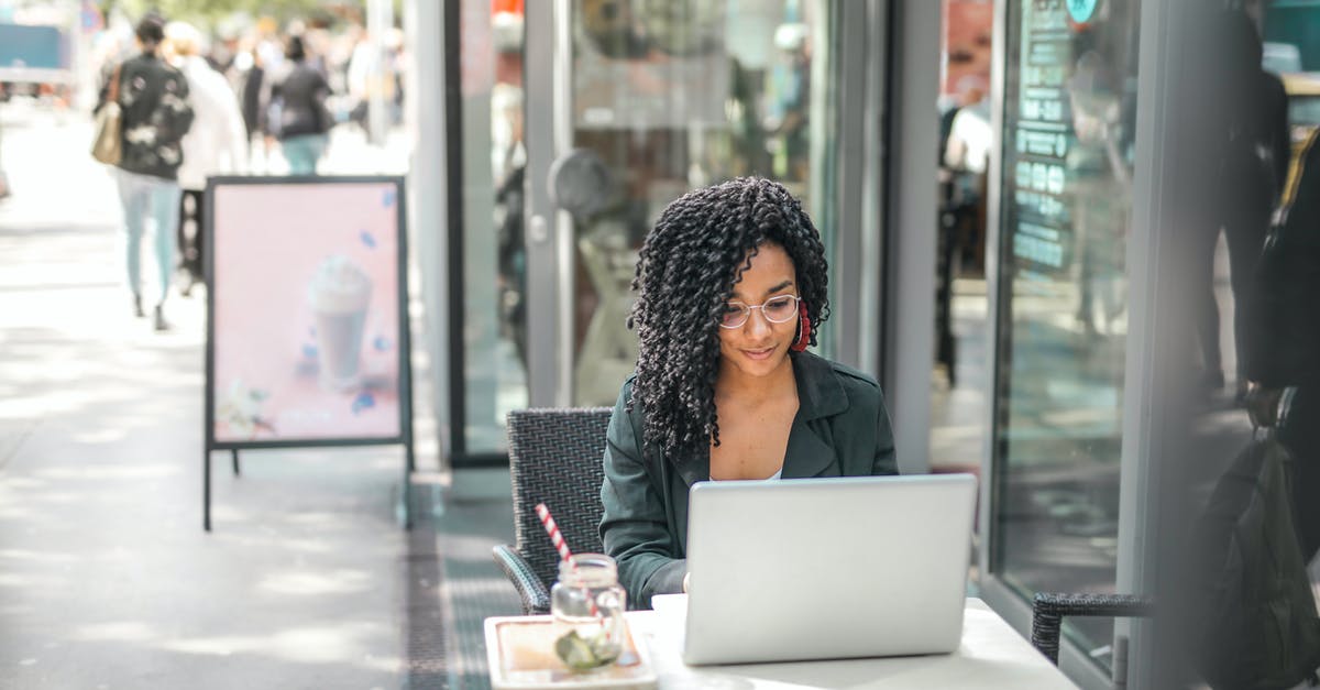 Can I use an Australia work visa for tourism? - High angle of pensive African American female freelancer in glasses and casual clothes focusing on screen and interacting with netbook while sitting at table with glass of yummy drink on cafe terrace in sunny day Can I use an Australia work visa for tourism? - High angle of pensive African American female freelancer in glasses and casual clothes focusing on screen and interacting with netbook while sitting at table with glass of yummy drink on cafe terrace in sunny day