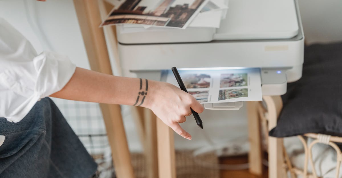 Can I use Indian electronic appliance in US - Woman printing photos on paper while forking at home Can I use Indian electronic appliance in US - Woman printing photos on paper while forking at home