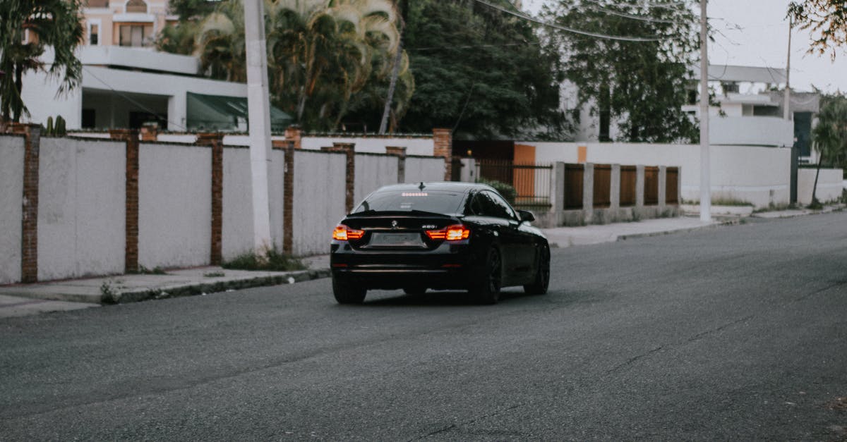 Can I use my UK provisional Driving Licence as a residence permit? - Car driving along empty street in suburb Can I use my UK provisional Driving Licence as a residence permit? - Car driving along empty street in suburb