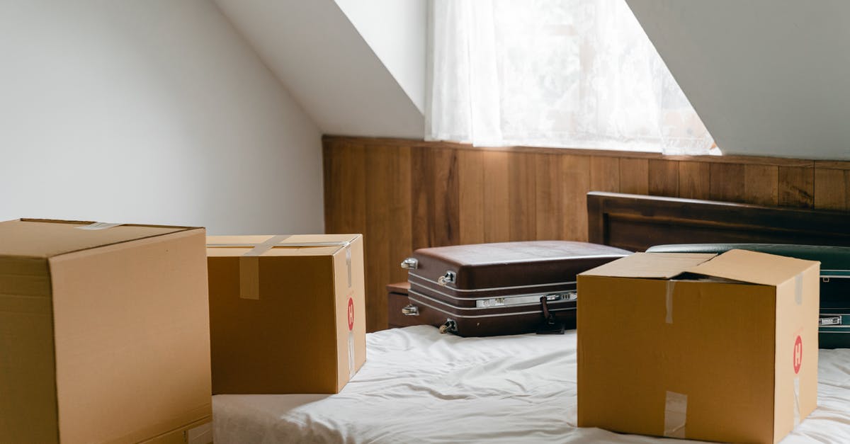 Can I use plastic bag as a personal item - Small cardboard boxes and leather cases placed on bed with sheet near big box in light room of house under sloping roof Can I use plastic bag as a personal item - Small cardboard boxes and leather cases placed on bed with sheet near big box in light room of house under sloping roof