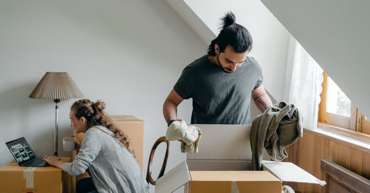 Can I use the same photo for a new Schengen visa application that was used in the previous visa? - Woman browsing internet on laptop and boyfriend doing housework