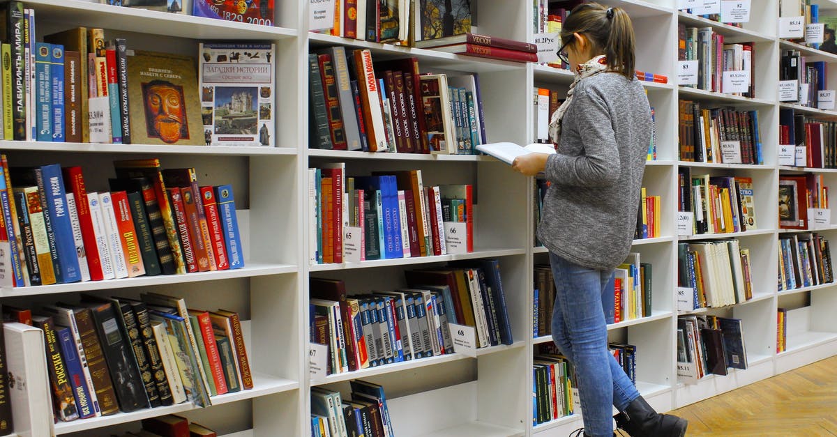 Can I visit the Trinity College (Cambridge) library and see some of their rare books - Woman Reading Book Can I visit the Trinity College (Cambridge) library and see some of their rare books - Woman Reading Book