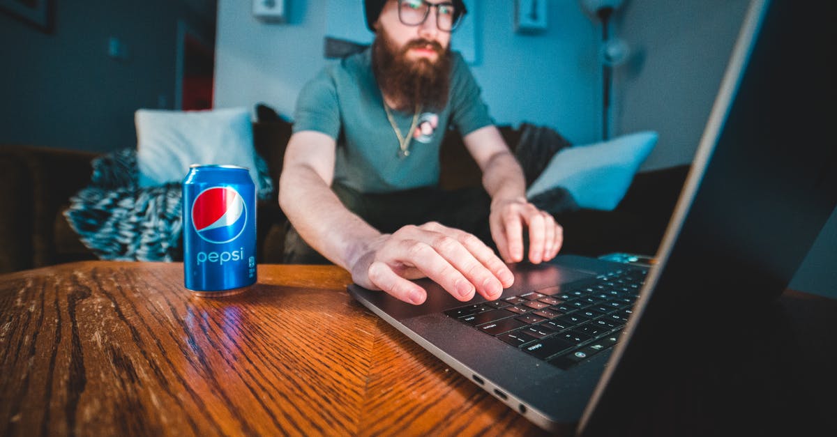 Can I work remotely while being a tourist in Russia? - Man in Blue Polo Shirt Using Black Laptop Computer Can I work remotely while being a tourist in Russia? - Man in Blue Polo Shirt Using Black Laptop Computer