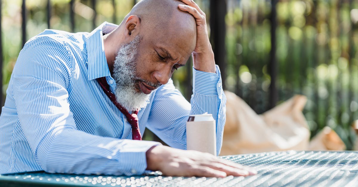 Can Korean American men visit South Korea without being drafted? [closed] - Thoughtful black man sitting at table in veranda