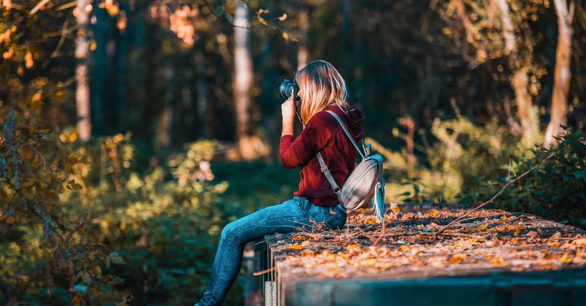 Can my DS160 photo and the photo I take to my appointment be different? - Woman Taking Picture Using Camera