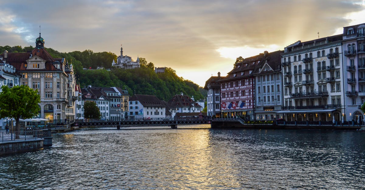 Can my family get a tourist visa for Switzerland from India - Old buildings on canal in sunset Can my family get a tourist visa for Switzerland from India - Old buildings on canal in sunset