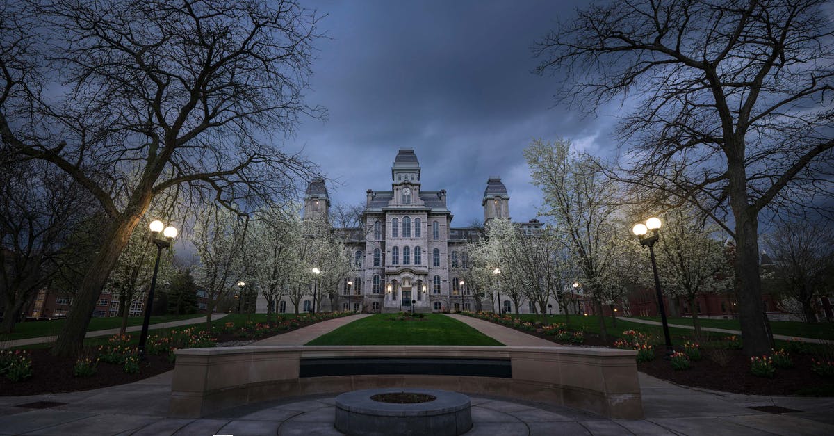 Can my UK university have my US visa cancelled? - Old building with ornamental facade in evening Can my UK university have my US visa cancelled? - Old building with ornamental facade in evening