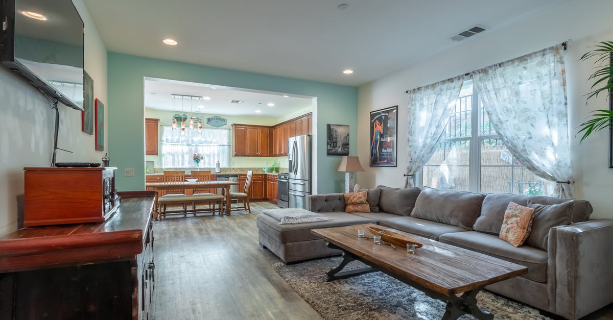 Can one obtain a visa for a third country in their home country if they do not currently live in the home country? - Interior of stylish living room and kitchen on daytime