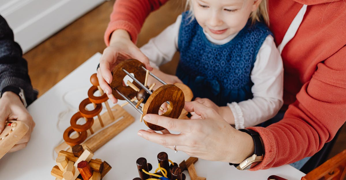 Can one take wooden toys to Australia? - Overhead Shot of a Person's Hands Solving a Puzzle Can one take wooden toys to Australia? - Overhead Shot of a Person's Hands Solving a Puzzle
