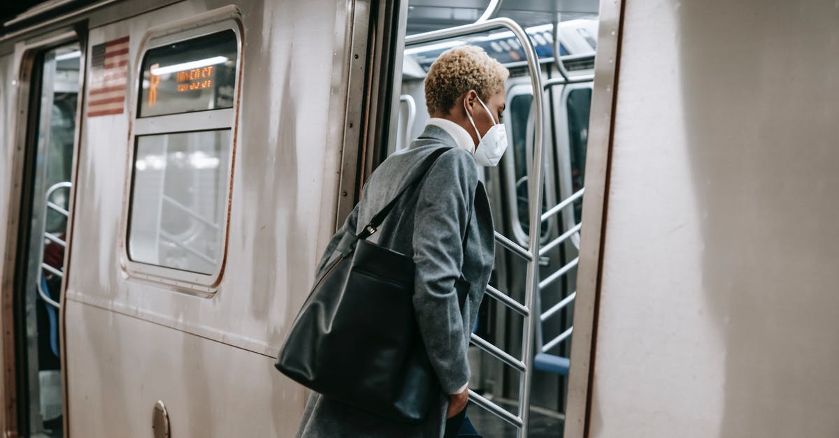 Can Polish citizens enter Turkey for transit with National ID? - Black woman in mask entering metro train Can Polish citizens enter Turkey for transit with National ID? - Black woman in mask entering metro train