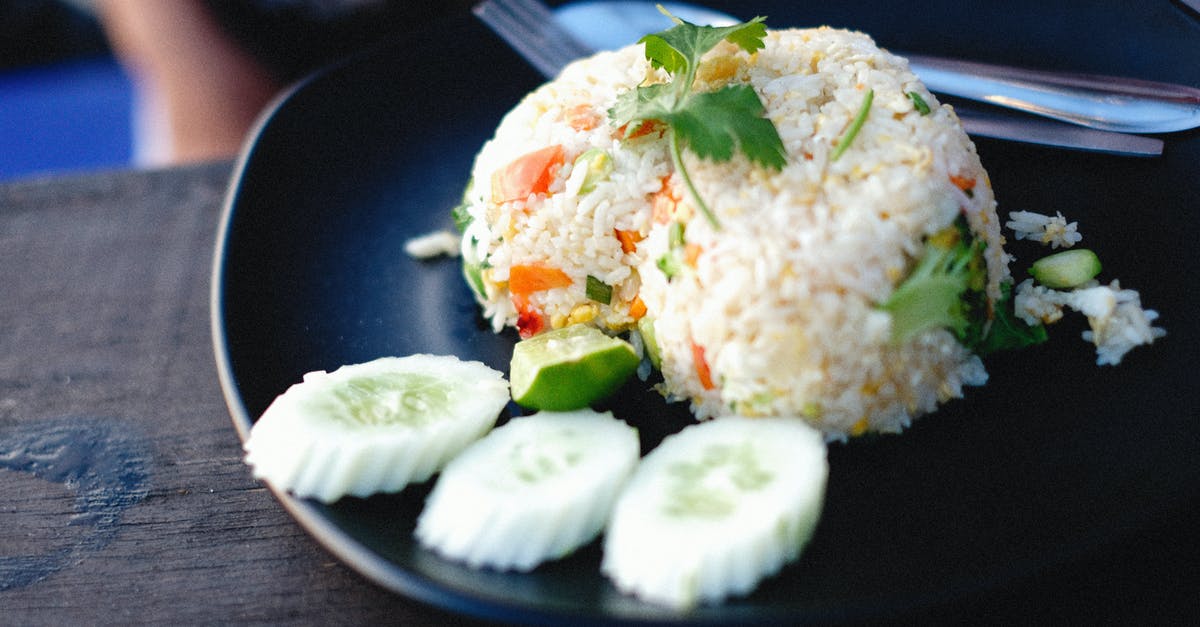 Can rice be brought into Hawaii? - White Rice With Green Leaf Vegetable on Blue Ceramic Plate Can rice be brought into Hawaii? - White Rice With Green Leaf Vegetable on Blue Ceramic Plate