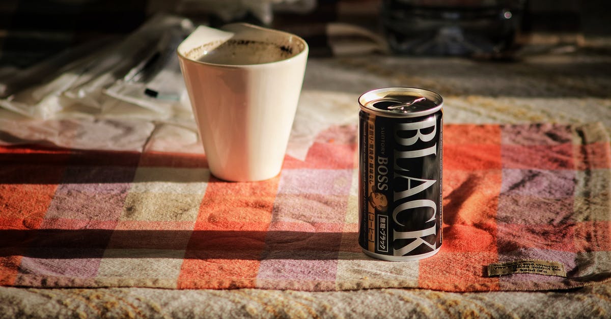 Can tourists go skiing in Yemen? - Black Boss Can on Top Beside White Mug Can tourists go skiing in Yemen? - Black Boss Can on Top Beside White Mug