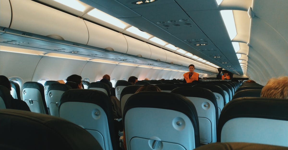 Can you book West Jet Vacation to use West Jet Dollars they owe you, check in but not board flight and just use the hotel stay? - Inside of modern airplane cabin with passengers sitting on comfortable seats and cabin crew standing at passageway Can you book West Jet Vacation to use West Jet Dollars they owe you, check in but not board flight and just use the hotel stay? - Inside of modern airplane cabin with passengers sitting on comfortable seats and cabin crew standing at passageway