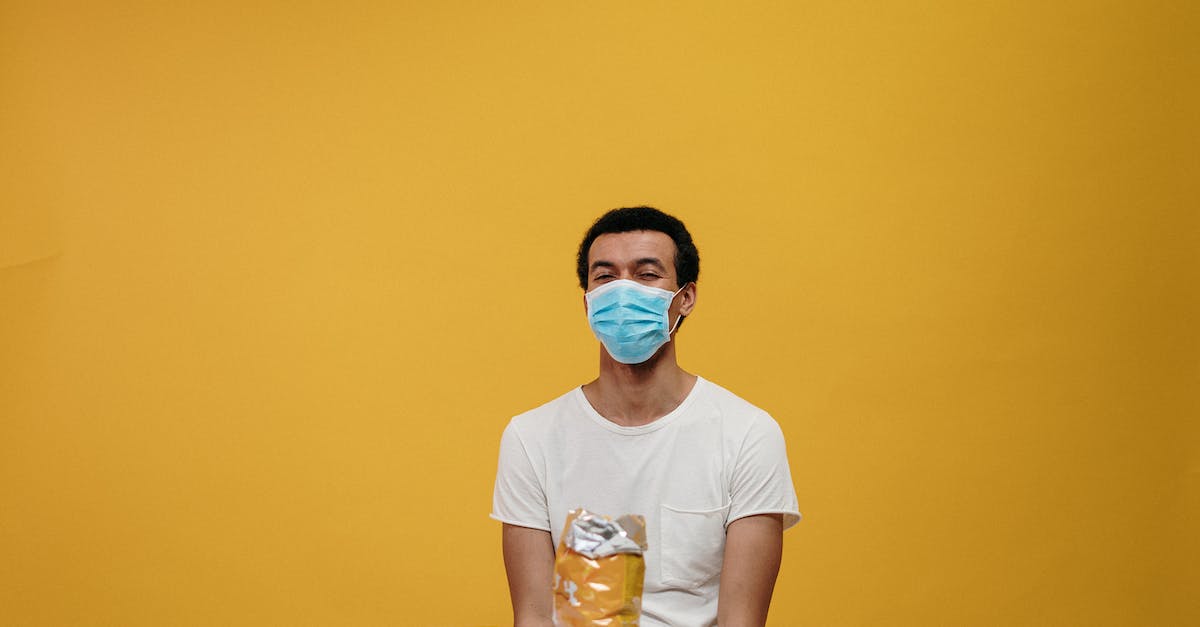 Can you eat food refused by quarantine by Australian border control? - Man in White Crew Neck T-shirt Sitting by the Table