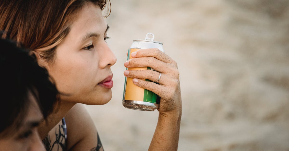 Can you extend visa waiver program admission to face trial in US? - Woman Holding Can While Sitting on the Beach