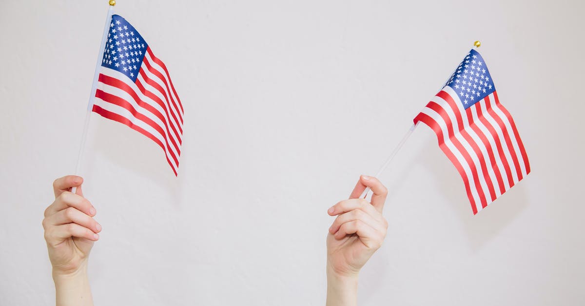Can you leave the country for more than 90 days on a Germany Youth Mobility Visa? If not, does any other Schengen country's visa let you do that? - Unrecognizable woman with American flags in hands