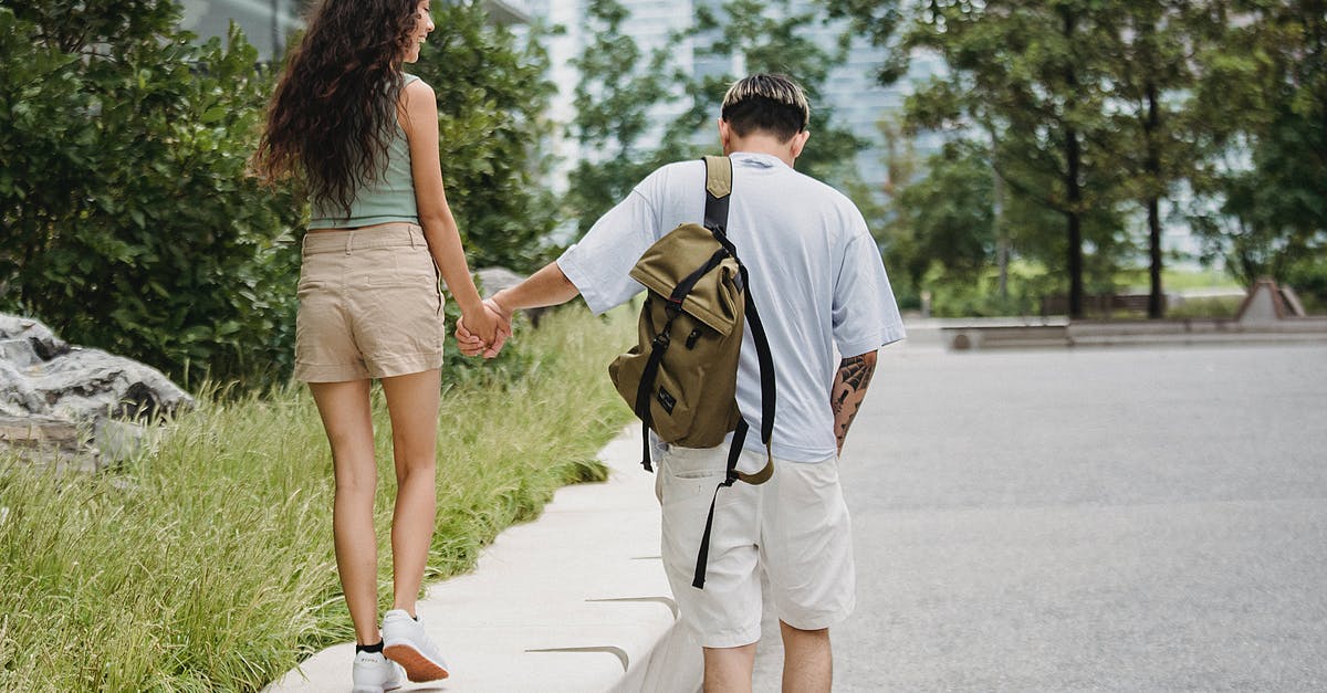 Can you "back date" a European working holiday visa so past Schengen time doesn't count? [closed] - Stylish young couple holding hand and walking in city park