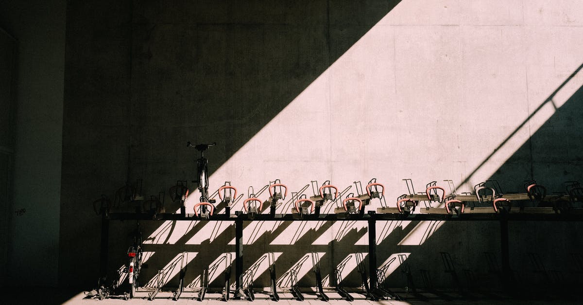 Can you rent a bicycle in a city and return it in another one in France? - Bicycle parking near concrete wall Can you rent a bicycle in a city and return it in another one in France? - Bicycle parking near concrete wall