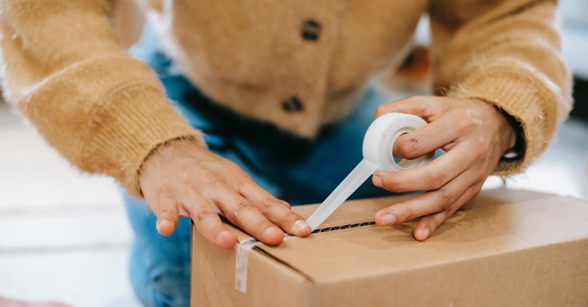 Can you send a SENTRI by mail to another country? - Crop unrecognizable woman sealing carton parcel with tape Can you send a SENTRI by mail to another country? - Crop unrecognizable woman sealing carton parcel with tape