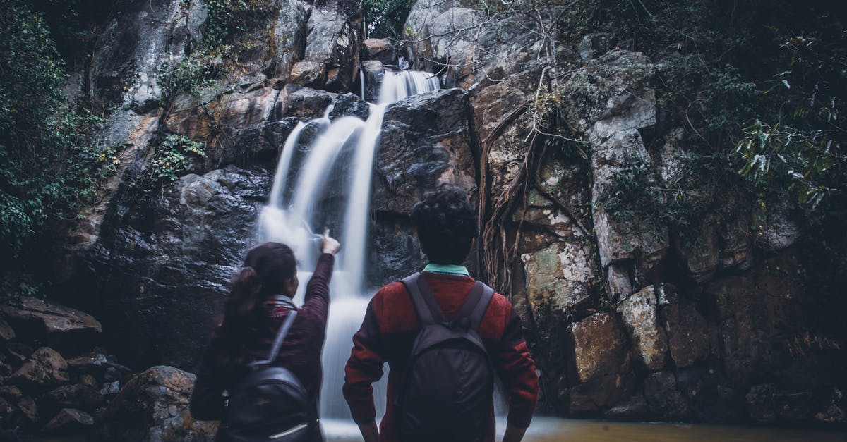 Can you split India in distinct focal points to travel to? - Back view of unrecognizable female traveler in casual clothes and backpack pointing at fast Midubanda Waterfall while admiring nature during trip in India with boyfriend Can you split India in distinct focal points to travel to? - Back view of unrecognizable female traveler in casual clothes and backpack pointing at fast Midubanda Waterfall while admiring nature during trip in India with boyfriend