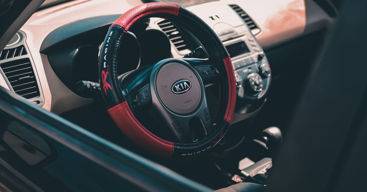 Can you travel 'above' the control of a country? - From above of contemporary design car interior with colorful steering wheel and radio with buttons Can you travel 'above' the control of a country? - From above of contemporary design car interior with colorful steering wheel and radio with buttons