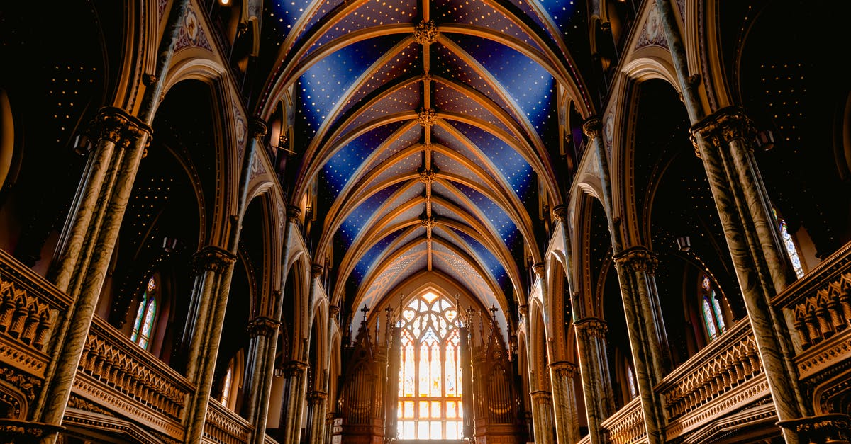Can you travel to Canada if banned from the USA? - Interior of old Roman Catholic cathedral with wooden arched details Can you travel to Canada if banned from the USA? - Interior of old Roman Catholic cathedral with wooden arched details
