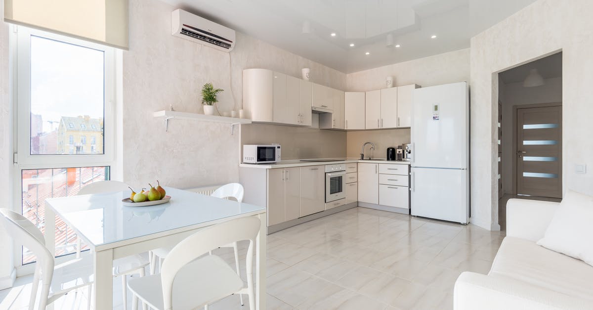 Canada: Entry by Air - Interior of spacious light kitchen with dining zone Canada: Entry by Air - Interior of spacious light kitchen with dining zone