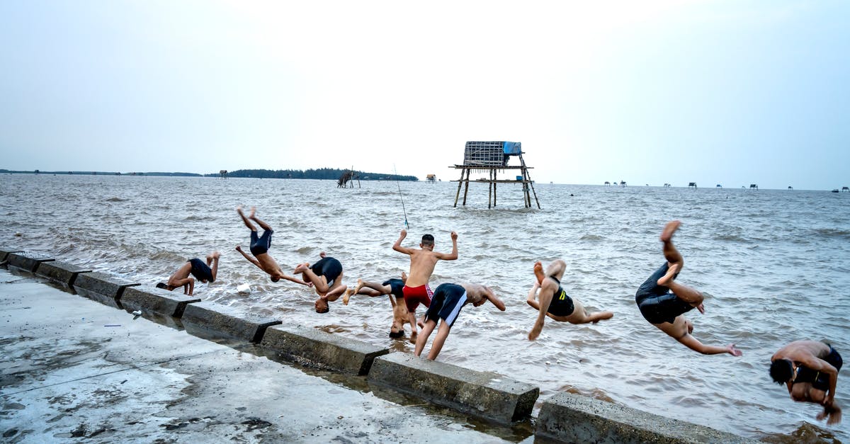 Canadian helping a friend in the States work on his house - Group of local boys diving into sea