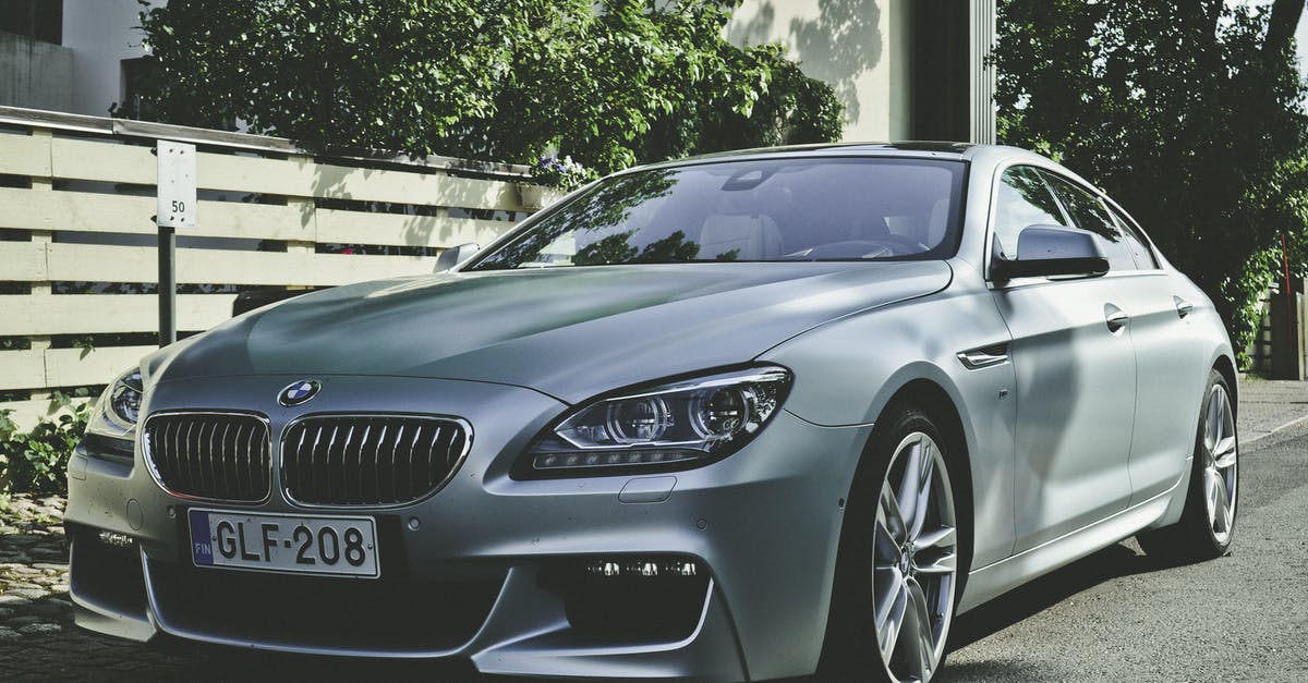 Canadian renting car in Finland and driving sports team members - Silver Bmw Sedan Canadian renting car in Finland and driving sports team members - Silver Bmw Sedan