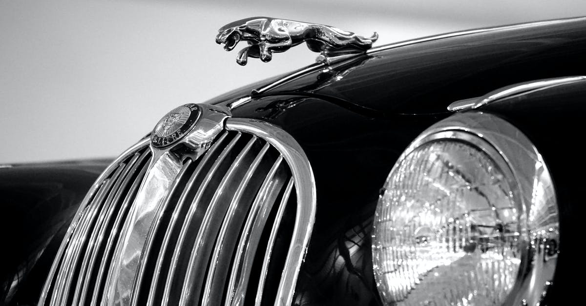 Canadian renting car in Finland and driving sports team members - Jaguar Emblem on Black Car Canadian renting car in Finland and driving sports team members - Jaguar Emblem on Black Car