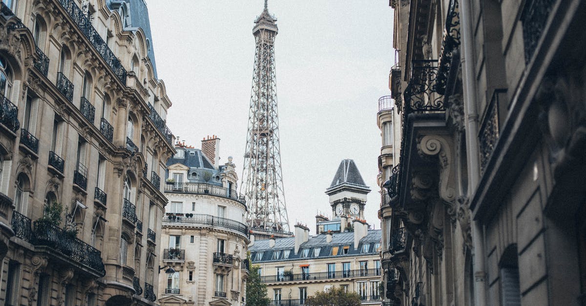 Canadian tourist visa after Paris attack - Eiffel Tower Behind Buildings Canadian tourist visa after Paris attack - Eiffel Tower Behind Buildings