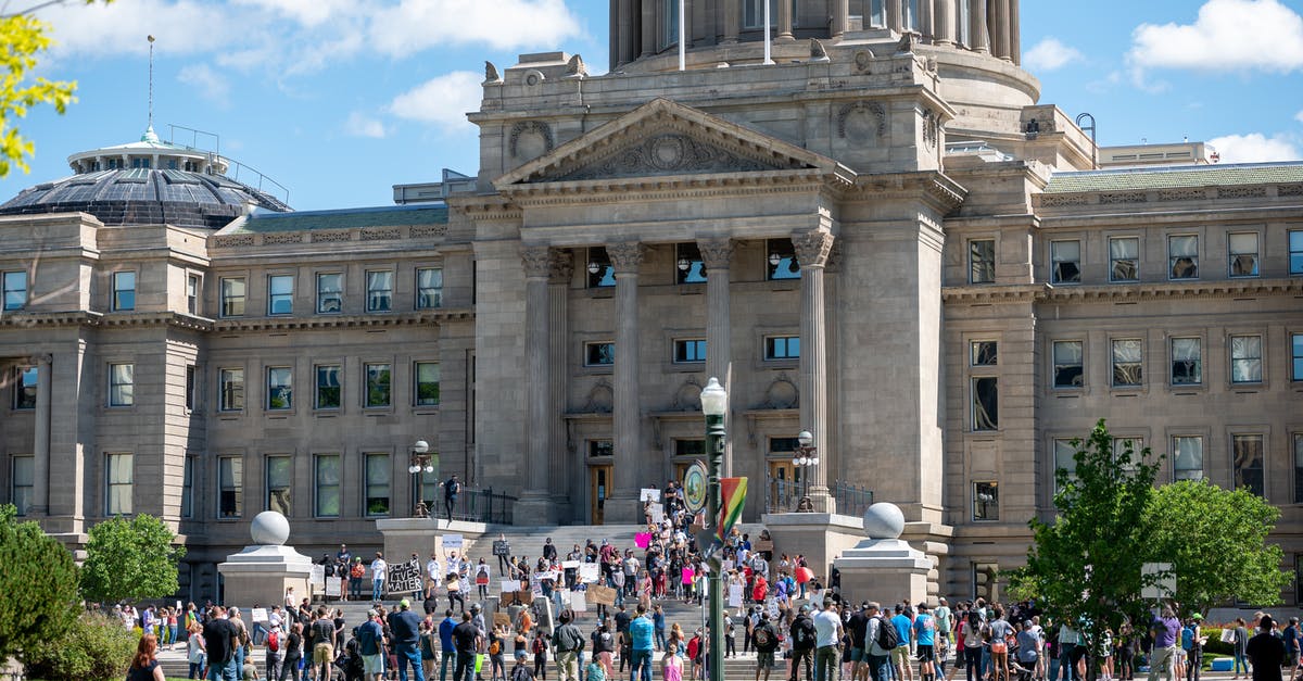 Canadian wants to go to US for meetings - People gathering outside majestic Idaho State Capitol building for meeting on sunny day in Boise City Canadian wants to go to US for meetings - People gathering outside majestic Idaho State Capitol building for meeting on sunny day in Boise City