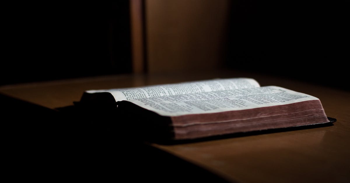 Cancelation fee on a unsuccessfully booked room - Close-up of Paper Against Black Background Cancelation fee on a unsuccessfully booked room - Close-up of Paper Against Black Background