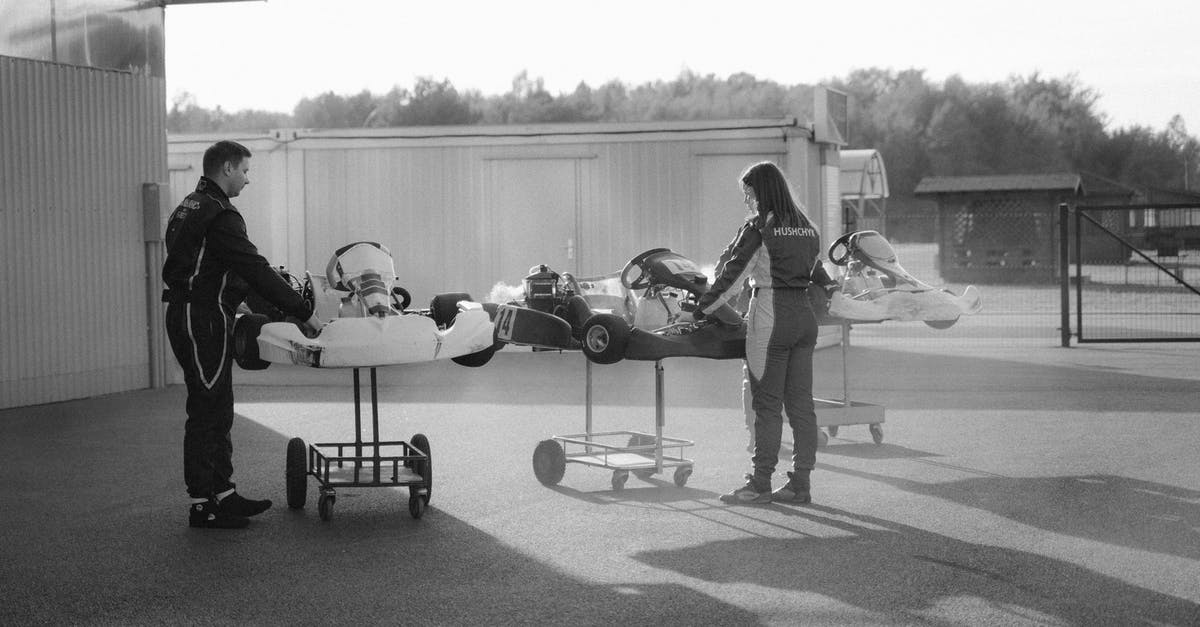 Cancelled Enhanced Drivers License - Man in Black Jacket and Pants Sitting on Black Chair Near White Airplane in Grayscale Photography Cancelled Enhanced Drivers License - Man in Black Jacket and Pants Sitting on Black Chair Near White Airplane in Grayscale Photography