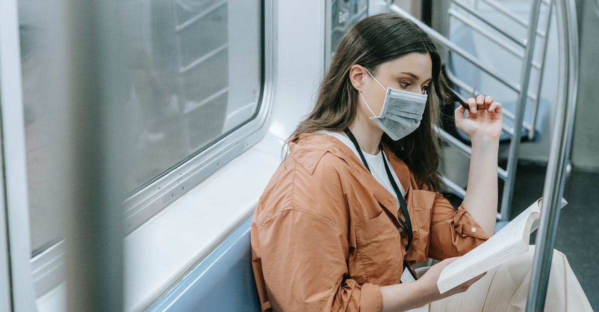 Cancelling booking on Booking.com due to COVID-19 - Photo of a Woman Reading Book Inside the Train Cancelling booking on Booking.com due to COVID-19 - Photo of a Woman Reading Book Inside the Train