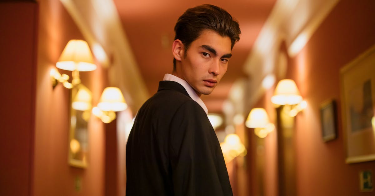 Cancelling hotel bookings after getting a Chinese visa - Man in Black Suit Jacket Cancelling hotel bookings after getting a Chinese visa - Man in Black Suit Jacket