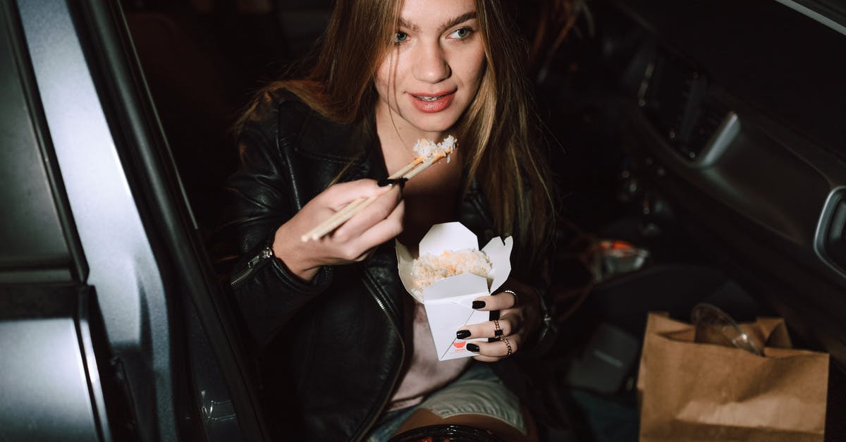 Car Hire Ireland/Wales/England - Woman in Black Leather Jacket Holding Ice Cream Cone Car Hire Ireland/Wales/England - Woman in Black Leather Jacket Holding Ice Cream Cone