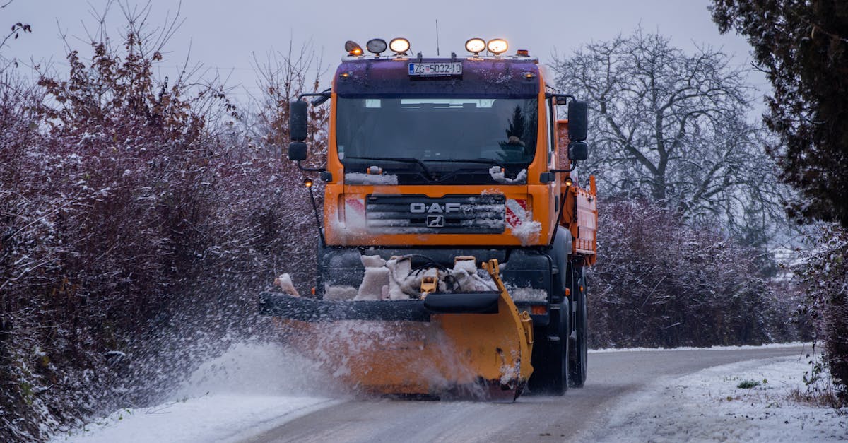 Car return / relocation services in Canada? - Yellow and Black Heavy Equipment on Snow Covered Ground