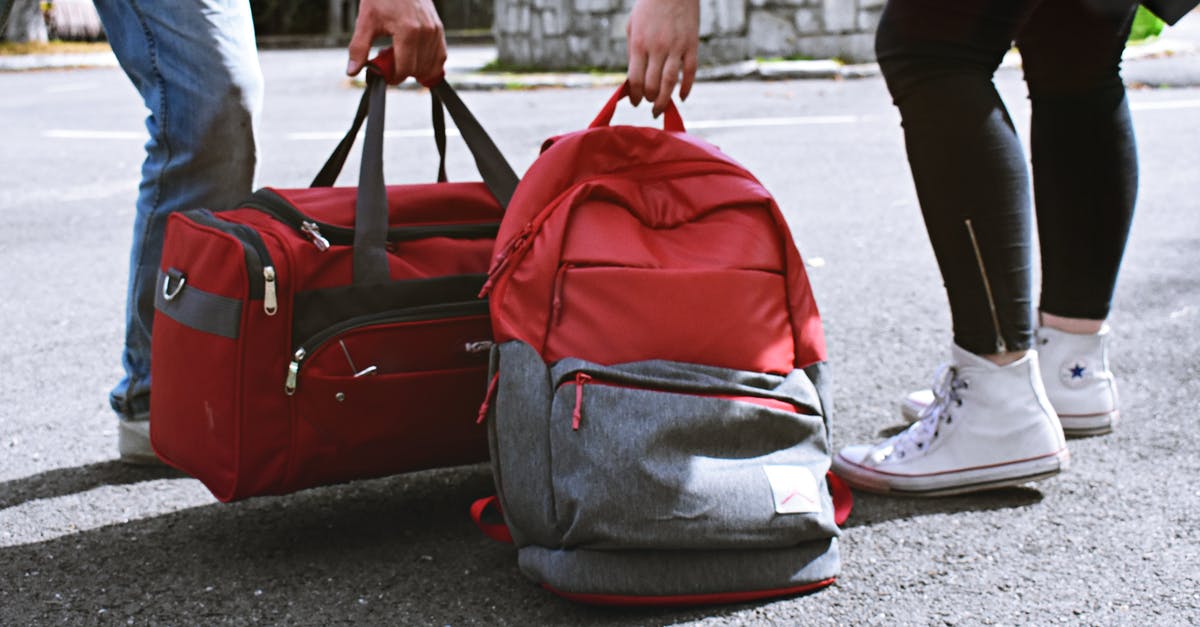 Carry on luggage larger than rules for one leg - Two Person Carrying Duffel and Backpack Carry on luggage larger than rules for one leg - Two Person Carrying Duffel and Backpack