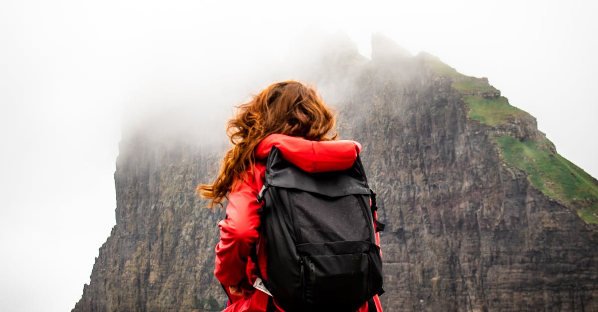 Carrying engagement ring in carry-on backpack. Must I declare it at the airport customs in Europe? [duplicate] - Back View of a Woman Carrying a Backpack Across the Mountain Covered by Clouds