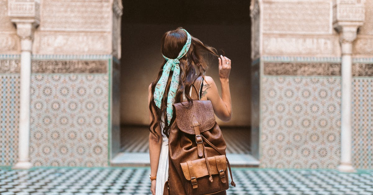 Carrying engagement ring in carry-on backpack. Must I declare it at the airport customs in Europe? [duplicate] - A Woman Carrying a Brown Leather Rucksack