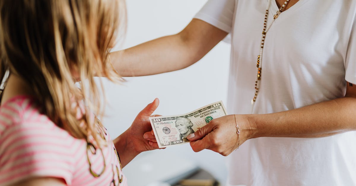 Cash allowance while transiting through Zurich - Woman Giving 10 Dollars to a Girl Cash allowance while transiting through Zurich - Woman Giving 10 Dollars to a Girl